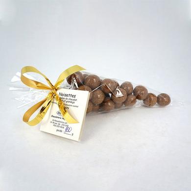 Hazelnuts coated with milk chocolate and gianduja